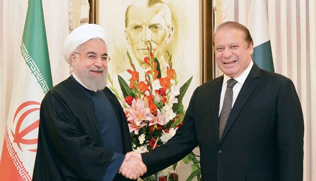 Prime Minister Nawaz Sharif and Pakistan Army Chief Raheel Sharif shake hands with Iranian President Hassan Rouhani.