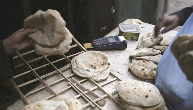 A smart card unit used to pay for subsidised bread is seen at a bakery in Cairo. Under the smart card programme, each family is provided with a plastic card enabling it to buy five small flat loaves of bread per family member a day.