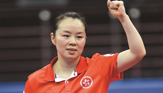 Tie Yana of Hong Kong celebrates after winning quarter-final against Li Xue of France yesterday. PICTURE: Noushad Thekkayil