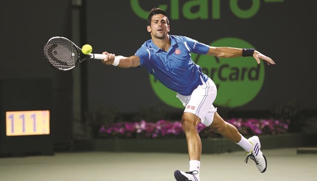 Novak Djokovic of Serbia plays a forehand against Kyle Edmund of Great Britain in their second round match during the Miami Open at Crandon Park Tennis Center in Key Biscayne, Florida. (Getty Images/AFP)