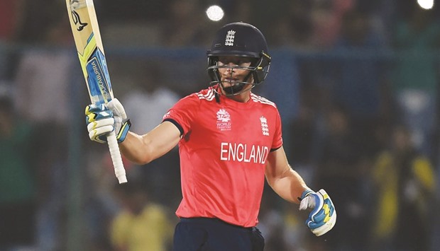 Englandu2019s Jos Buttler raises his bat after reacing his half-century against Sri Lanka at the Feroz Shah Kotla cricket ground in New Delhi yesterday.