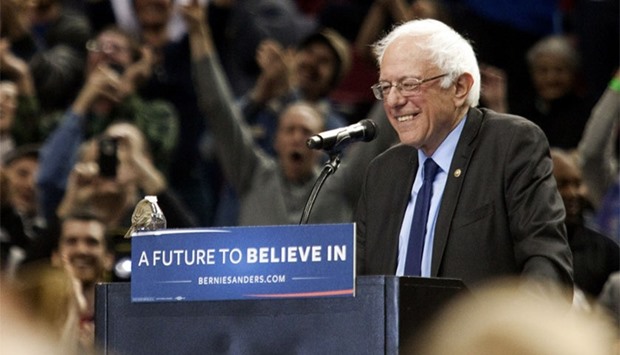 A bird lands on Democratic presidential candidate Bernie Sanders's podium as he speaks on March 25, 2016 in Portland, Oregon