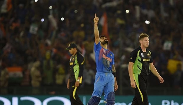 Virat Kohli celebrates after Indiau2019s victory in the World T20 cricket match against Australia in Mohali on Sunday.