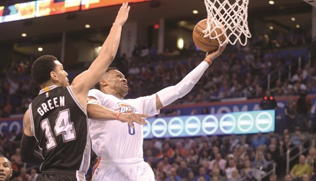 Oklahoma City Thunder guard Russell Westbrook (R) drives to the basket in front of San Antonio Spurs guard Danny Green during the second quarter at Chesapeake Energy Arena. PICTURE: USA TODAY Sports
