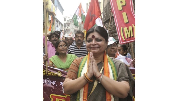 Congress Party candidate Deepa Dasmunshi greets supporters during an election campaign ahead of West Bengal assembly polls in Kolkata yesterday.