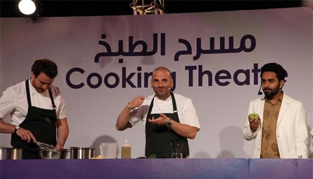Celebrity chefs led George Calombaris (centre) by showcase their cooking skills during a live demo at QIFF 2016.