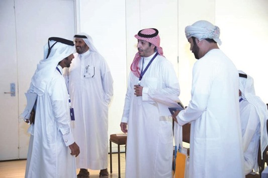 Some of the participants interacting with Faisal Abdullah al-Nuaimi (left) at the workshop.