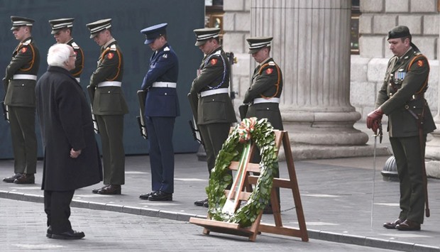 Irish President Michael D Higgins lays a wreath in front of the GPO during the commemoration of the 100 year anniversary of the Irish Easter Rising in Dublin, Ireland, yesterday.
