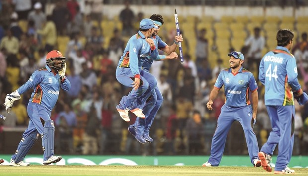 Afghanistanu2019s players celebrate after winning the World T20 cricket tournament match against the West Indies at the Vidarbha Cricket Association Stadium in Nagpur yesterday.