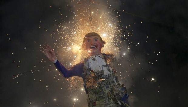 Mexicans celebrating an Easter ritual burn an effigy of US Republican presidential hopeful Trump in Mexico City. Reuters