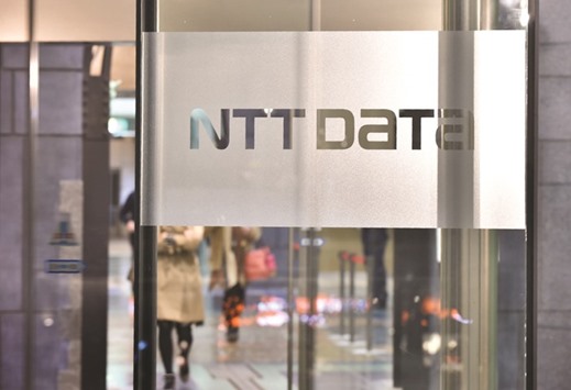 The logo of the NTT Data Corporation is displayed at the entrance to the companyu2019s headquarters in Tokyo. The $3bn Dell deal will offer the Japanese firm a bigger foothold in the US, where it is looking to expand in healthcare IT, insurance and financial services consulting, sources said yesterday.