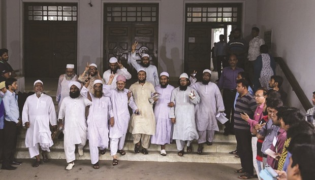 Islamist leaders flash victory signs after the Bangladesh High Court rejected a petition challenging Islam as the state religion in Dhaka yesterday.