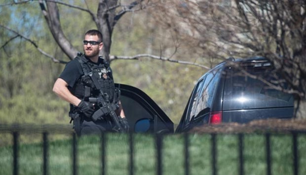 A US Secret Service agent stands guard at the White House in Washington, DC, on Monday.