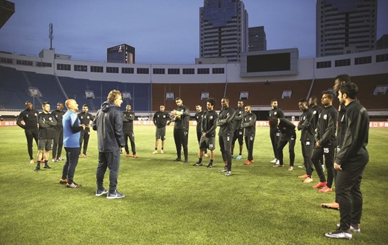 Qatar coach Daniel Carreno talks to his players during a training session in Xiu2019an, China, yesterday. Qatar will be aiming to beat China in their Group C match in the Asian World Cup qualifying campaign today.