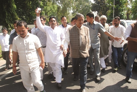Congress leaders led by former chief minister Harish Rawat come out after meeting Uttarakhand Governor K K Paul in Dehradun yesterday.