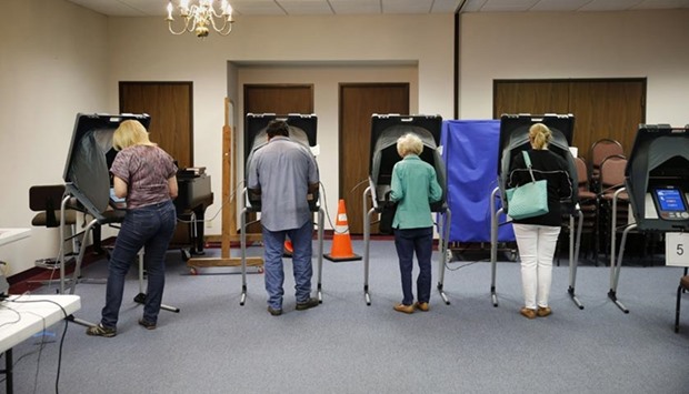 Voters cast their ballots inside Calvary Baptist Church in Rosenberg, Texas.