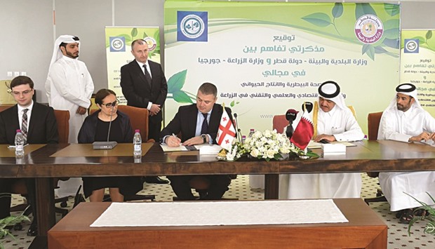HE the Minister of Municipality and Environment Mohamed bin Abdullah al-Rumaihi and the Georgian Minister of Agriculture Otar Danelia signing an MoU in Doha yesterday.