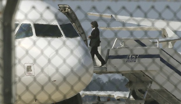 An official boards a hijacked Egyptair A320 Airbus at Larnaca Airport in Larnaca, Cyprus. Reuters