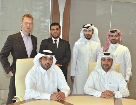 QIC and QMIC officials during the launch of the PHYD car insurance.