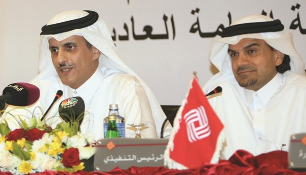 QIIB chairman and managing director Sheikh Dr Khalid bin Thani bin Abdullah al-Thani (left) with CEO Abdulbasit A al-Shaibei at the banku2019s AGM at Ezdan Tower in Doha yesterday. PICTURE: Nasar TK