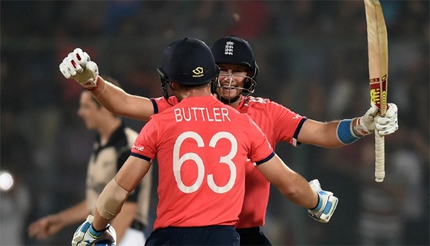 England's Jos Buttler (L) and Joe Root celebrate after winning the World T20 cricket tournament