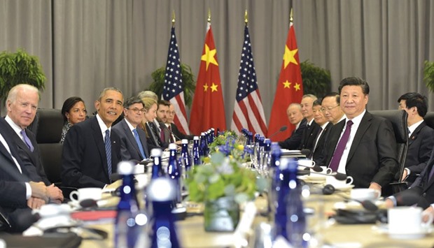 Obama, Vice-President Joe Biden and Xi with officials from both governments take part in a bilateral meeting on the sidelines of the Nuclear Security Summit at the Walter E Washington Convention Centre in Washington, DC.
