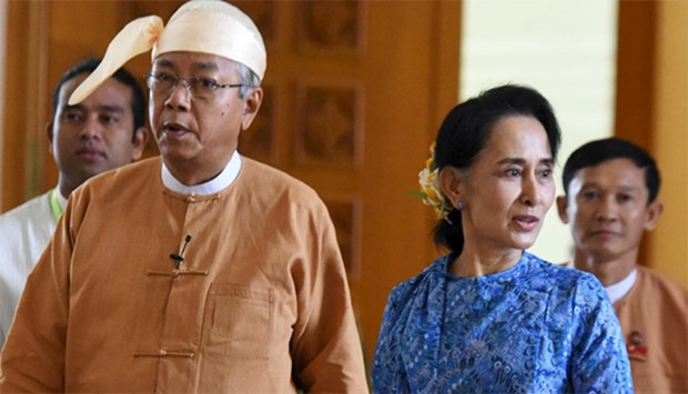 Myanmar's new president Htin Kyaw (L) and National League for Democracy party leader Aung San Suu Ky