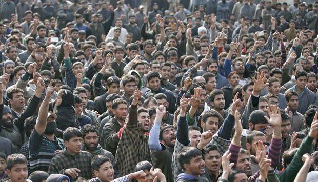 Villagers shout slogans during the funeral of Ashiq Hussain, a suspected militant, in Charsoo village in south Kashmir yesterday. Three suspected militants including Hussain were killed in a gun battle with security forces.