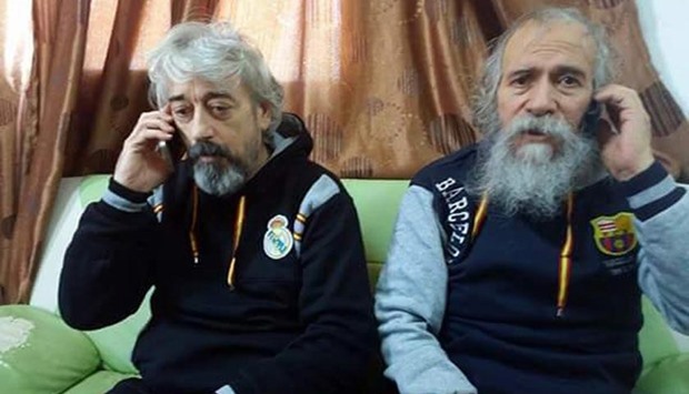 A handout picture provided by the Sabratha Municipal Council shows Gino Pollicardo (left) and Filippo Calcagno after they were released on Friday in the Libyan city of Sabratha.