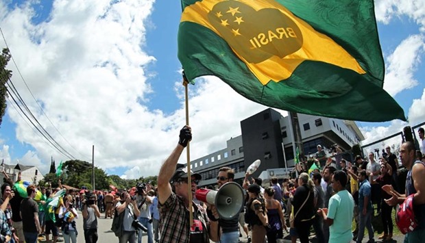 Supporters of Brazil's former president Luiz Inacio Lula da Silva gather in front of the Federal Police headquarters in Curitiba on Friday.