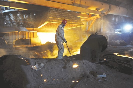 An employee works inside a steel factory in Xinjiang province. Chinau2019s overcapacity of steel is a major bone of contention and will be the subject of a meeting in Beijing next week between European Union and Chinese negotiators.