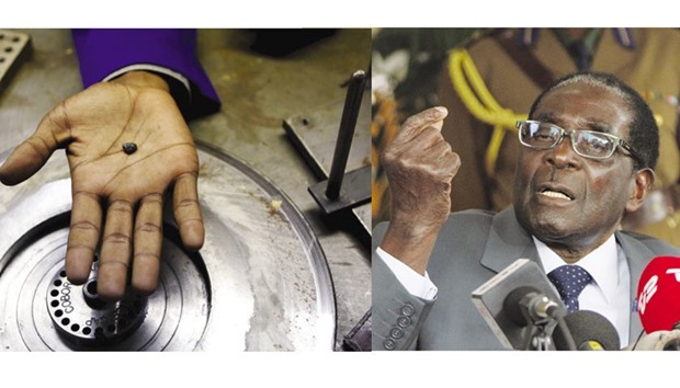 A Zimbabwean holds a piece of rough diamond from the countryu2019s Marange diamond fields, inside a polish and cutting shop in Harare in this February 10, 2014 file photo. President Mugabe (right) has said that his government would take possession of all diamond operations because existing miners had robbed the country of its wealth.