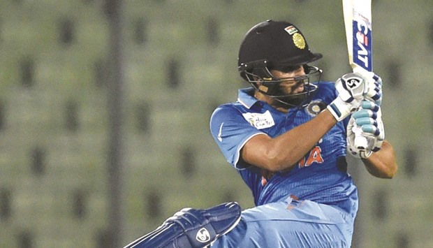 Indian cricketer Rohit Sharma plays a shot during the Asia Cup T20 cricket tournament match between United Arab Emirates and India at The Sher-e-Bangla National Cricket Stadium in Dhaka.