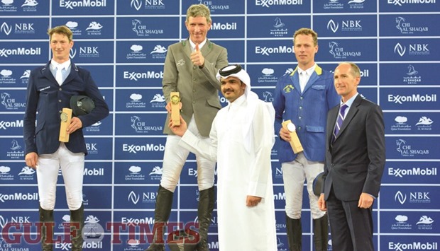 Qatar Olympic Committee President HE Sheikh Joaan bin Hamad al-Thani (third from left) presents the trophies to the winners of the CHI Al Shaqab Grand Prix at the Al Shaqab Arena yesterday. Germanyu2019s Ludger Beerbaum won the title, his second in Doha after 2014, followed by compatriots Daniel Deusser and Christian Ahlmann.