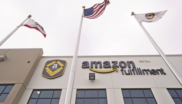 Amazon.com signage is displayed on the facade of its fulfilment centre in California. Amazon is dialling back on the security built into its tablets.