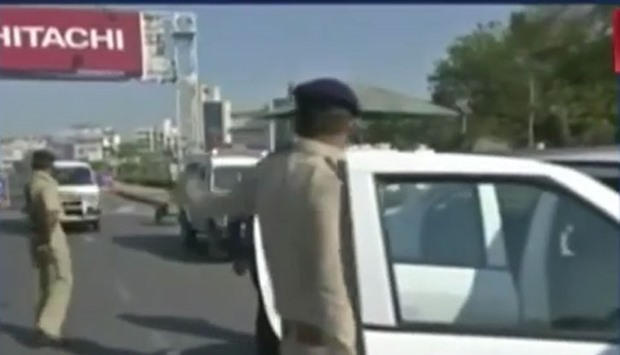Police inspect vehicles in Ahmedabad, Gujarat.