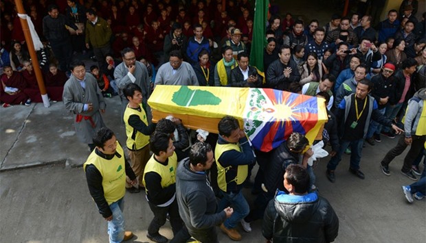 Members of the Tibetan Youth Congress carry the coffin bearing the body of Dorje Tsering during his funeral in the Indian town of McLeod Ganj. AFP