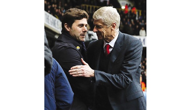 Arsenal manager Arsene Wenger (right) congratulates his Tottenham Hotspur counterpart Mauricio Pochettino following their 2-2 draw in the Premier League north London derby on Saturday.
