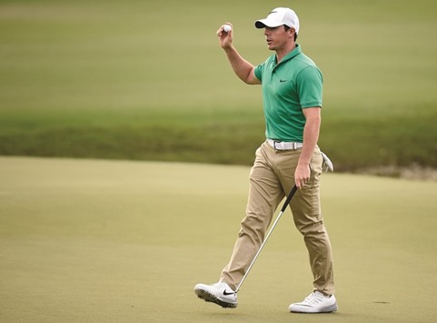 Rory McIlroy waves to the gallery after his putt on the 18th green during the third round at Trump National Doral.