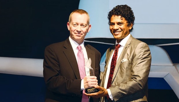 Qatar Airways Cargou2019s vice-president (Global Sales)  Daniel Parker (left) receives the award from Hemanth DP, chief operating officer (Aero Commercial-Cargo & Asia Pacific Flying School) GMR Airports.