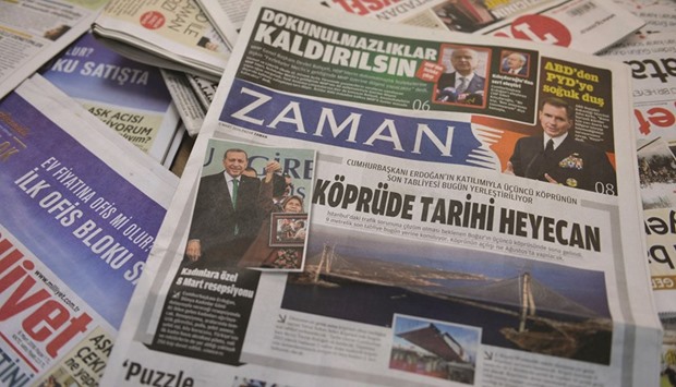 A photo taken yesterday shows the front page of the first new edition of Zaman, which had staunchly opposed the president, now with articles supporting the government since its seizure by authorities.
