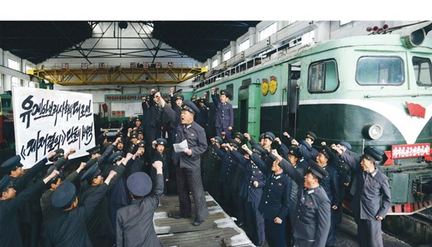 This photo released from North Koreau2019s official Korean Central News Agency (KCNA) shows West Pyongyang railway workers protesting against United Nation Security Councilu2019s resolution on North Korea.