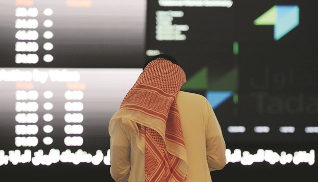 A Saudi investor monitors share prices at the Saudi Stock Exchange, or Tadawul, in Riyadh. The benchmark yesterday rose 2.9% in the highest volume since January 20.