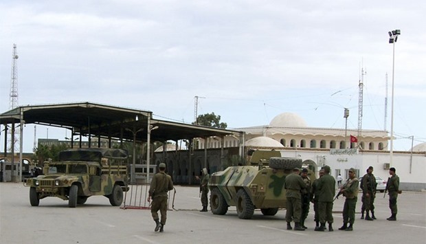 File photo of Tunisian soldiers standing guard at the border crossing at Ras Jdir Ben Guerdane.