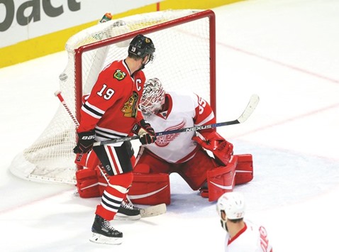 Chicago Blackhawks center Jonathan Toews (No 19) tips a shot past Detroit Red Wings goalie Jimmy Howard for a goal during the third period at the United Center. Chicago won 4-1. PICTURE: USA TODAY Sports