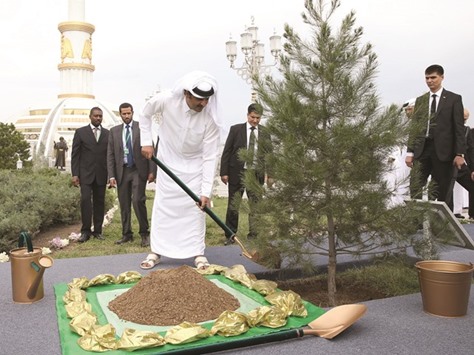 HH the Emir Sheikh Tamim bin Hamad al-Thani planting a tree on the occasion of his visit to Turkmenistan, in the capital Ashgabat yesterday.