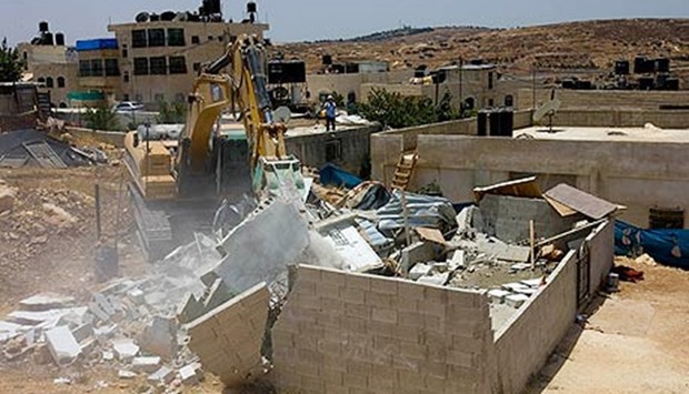 A Palestinian house is demolished