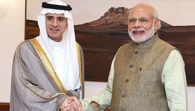 Saudi Arabian Foreign Minister Adel al-Jubeir shakes hands with Prime Minister Narendra Modi in New Delhi yesterday.