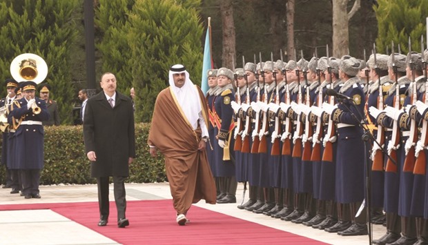 HH the Emir Sheikh Tamim bin Hamad al-Thani, accompanied by President of Azerbaijan Ilham Alyiev, inspects a guard of honour at the presidential palace in Baku yesterday.