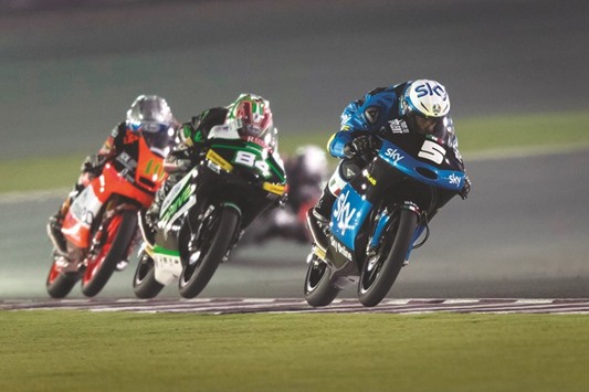 Romano Fenati (R) in action during the 2015 Moto3 race in Qatar.